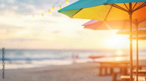 Vibrant beach market with colorful umbrellas and blurred ocean sunset scene