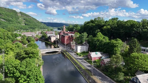 Bellows Falls, VT stock drone video of the small downtown area in the incorporated village located in Rockingham, Vermont on a summer day