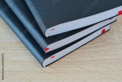 A stack of diaries on the table