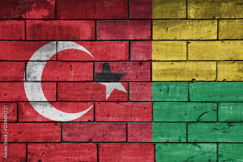 colourful painted big flag of turkey and flag of guinea bissau on a massive old brick wall background. concept