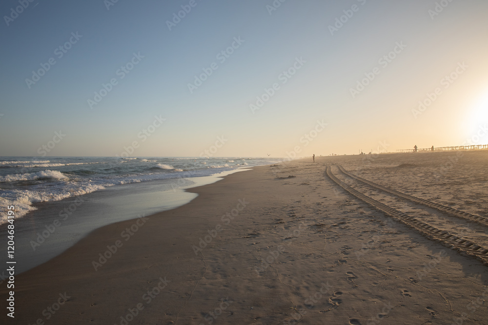 Sunset Over Peaceful Beach With Ocean Waves