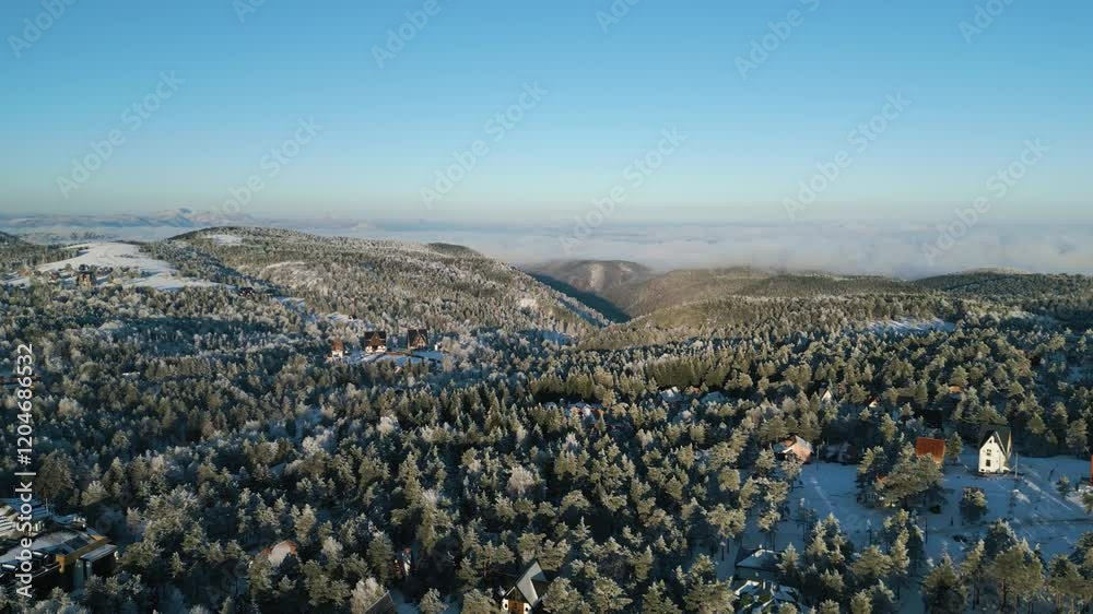 Aerial view of snowy mountains and hills Aerial view of snowy mountains and hills