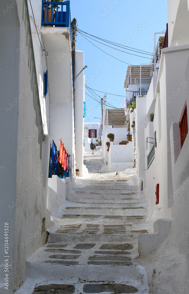 Fototapeta premium Mykonos, Greece: The steep steps leading to the upper reaches of the old Chora. 
