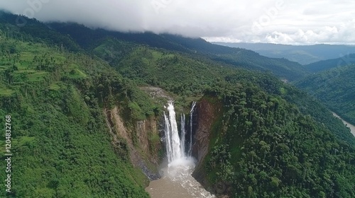 Aerial view Majestic waterfall cascading down lush green mountain valley
