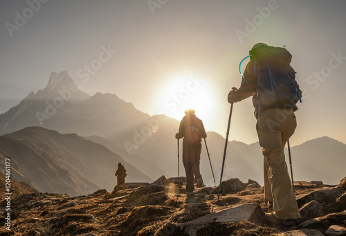 Tableau sur toile Group of tourist walking to Mardi Himal base camp with beautiful view of Mt