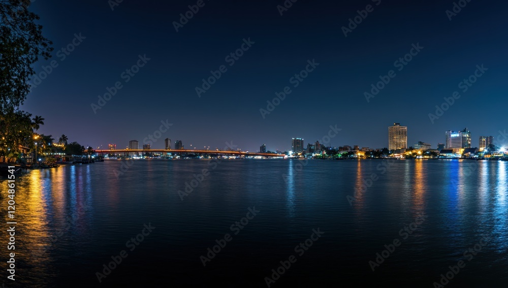 Obraz premium Night Lights Cityscape over Calm Waters