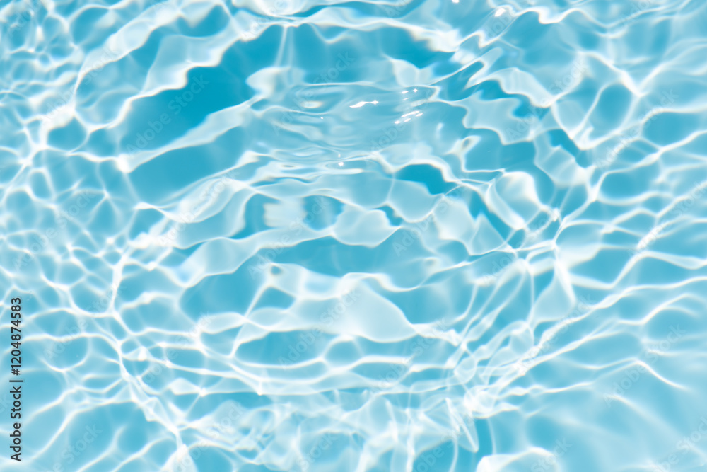 Fototapeta premium Blue water with ripples on the surface. Defocus blurred transparent blue colored clear calm water surface texture with splashes and bubbles. Water waves with shining pattern texture background.