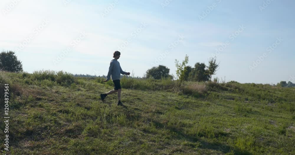 Young Caucasian Man Walks Hiking Countryside Nature Slow motion 60fps 4K 10-bit Young Caucasian Man Walks Hiking Countryside Nature Slow motion 60fps 4K 10-bit