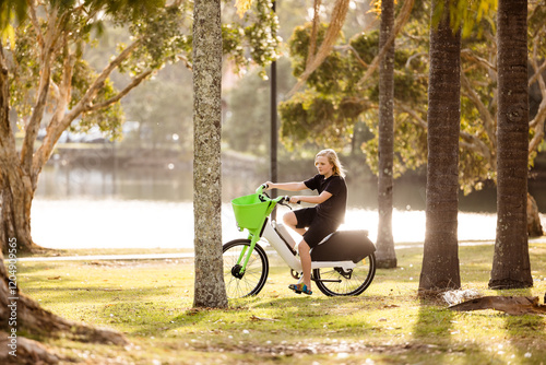 Teenage boy riding public motorised bike in Gold Coast park