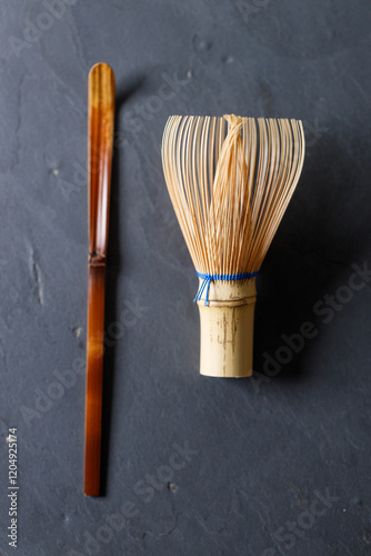 Closeup of Chasen or Bamboo whisk and Chashaku or tea scoop, equipments for preparing matcha green tea.
