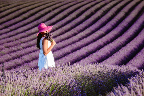 Woman in a lavender field in full bloom, Provence, France photo