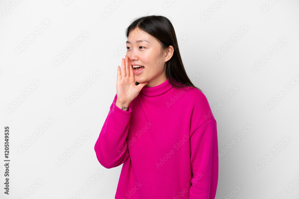 Young Chinese woman isolated on white background shouting with mouth wide open to the side