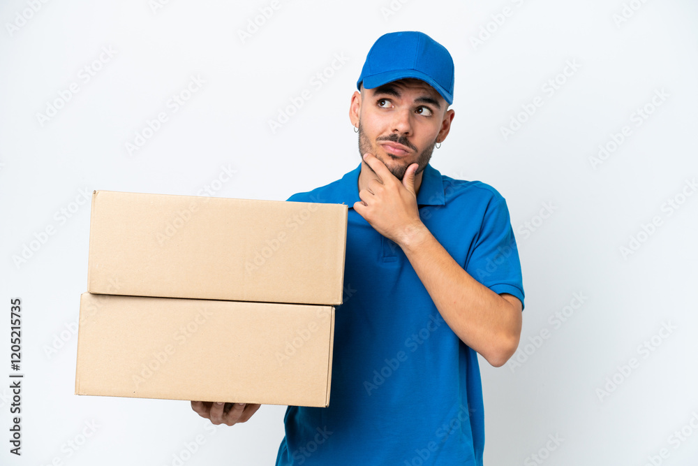 Delivery caucasian man isolated on white background having doubts Delivery caucasian man isolated on white background having doubts