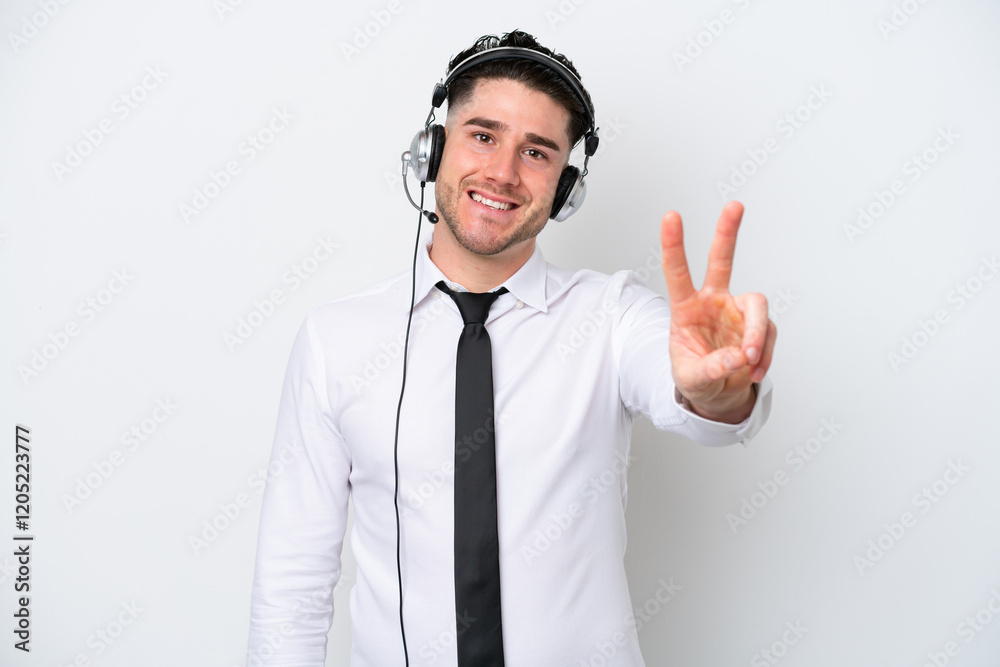 Telemarketer caucasian man isolated on white background smiling and showing victory sign Telemarketer caucasian man isolated on white background smiling and showing victory sign