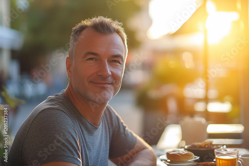 Middle aged man at outdoor having breakfast