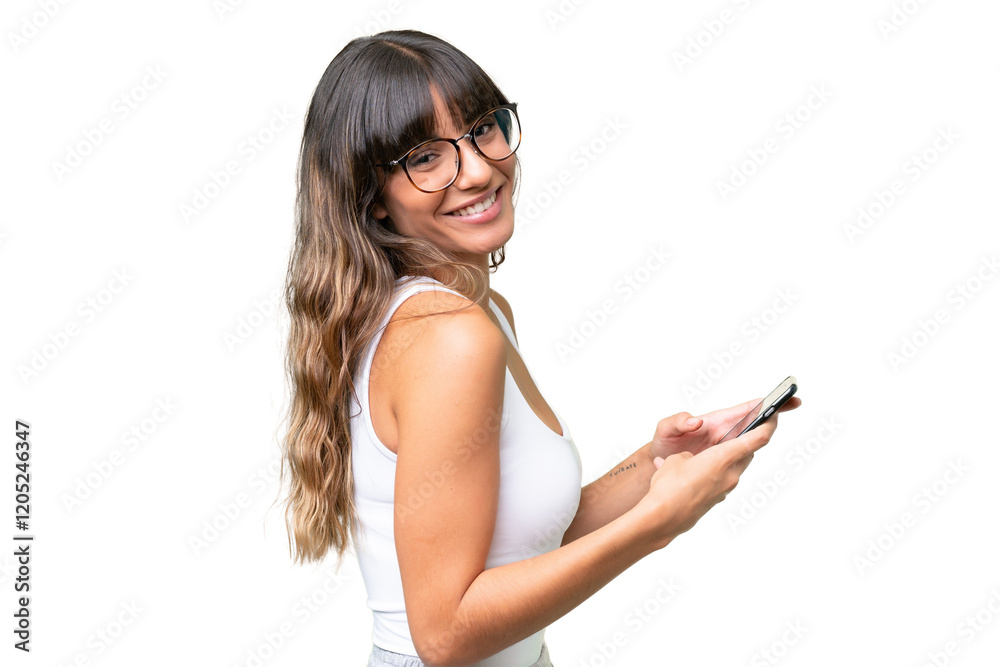 Young caucasian woman over isolated background sending a message or email with the mobile Young caucasian woman over isolated background sending a message or email with the mobile