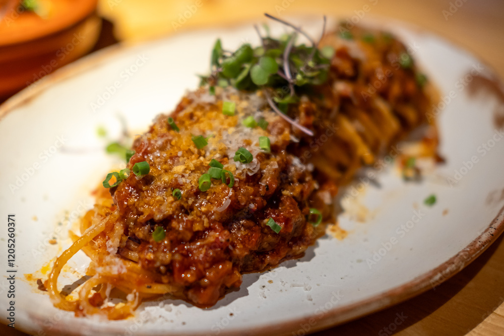 Spaghetti Bolognese, a meat-based sauce in Italian cuisine. served on plate Spaghetti Bolognese, a meat-based sauce in Italian cuisine. served on plate