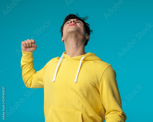 frustrated young man looking angry at God