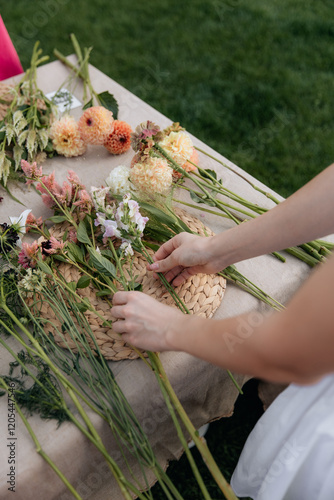 Close-up photo of a florist creating a bouquet of fresh flowers