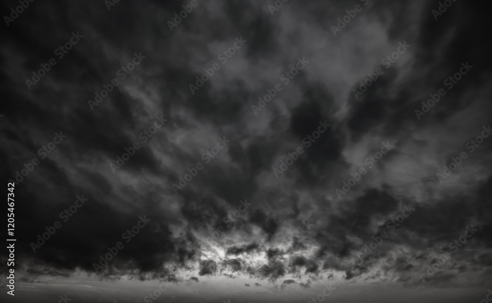 Fototapeta premium dark dramatic sky with black stormy clouds before rain as abstract background, extreme weather
