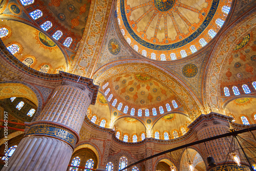 Photography interior of mosque, ceiling, domes are painted with patterns, decorative windows