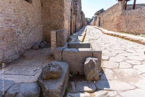 Street view of Pompei, ancient Roman colony buried under the ashes of mount Vesuvius, Italy	 photo