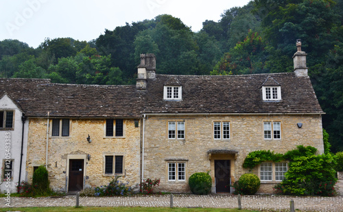 An old traditional house in picturesque Castle Combe village, Costwolds, Wiltshire, England, UK photo