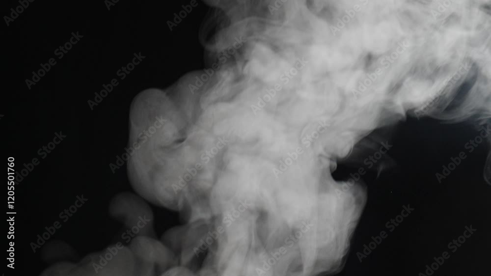 White smoke gently billowing, twisting against deep darkness, forming ethereal pattern with soft, hypnotic swirling motion and delicate visual texture. Cooking in restaurant kitchen. High cuisine