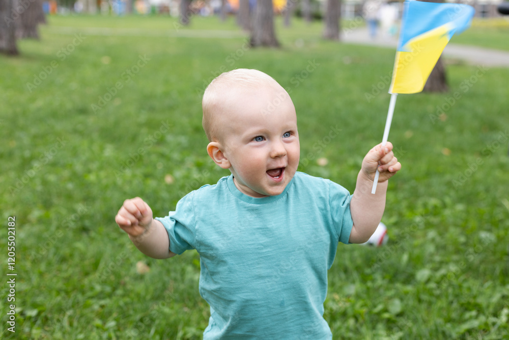 Triumphant little boy with Ukrainian flag in his hand. Triumphant little boy with Ukrainian flag in his hand.
