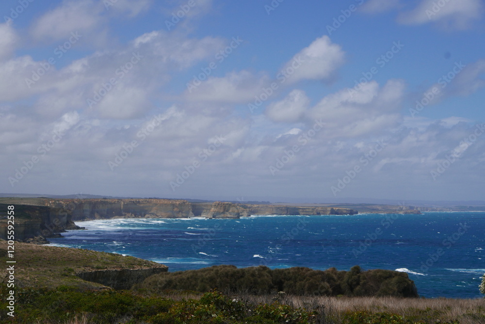 Port campbell in Great Ocean Road, in Victoria, Australia, is a scenic coastal drive famed for landmarks like the Twelve Apostles, rugged cliffs, lush rainforests, beaches, and charming seaside towns. Port campbell in Great Ocean Road, in Victoria, Australia, is a scenic coastal drive famed for landmarks like the Twelve Apostles, rugged cliffs, lush rainforests, beaches, and charming seaside towns.