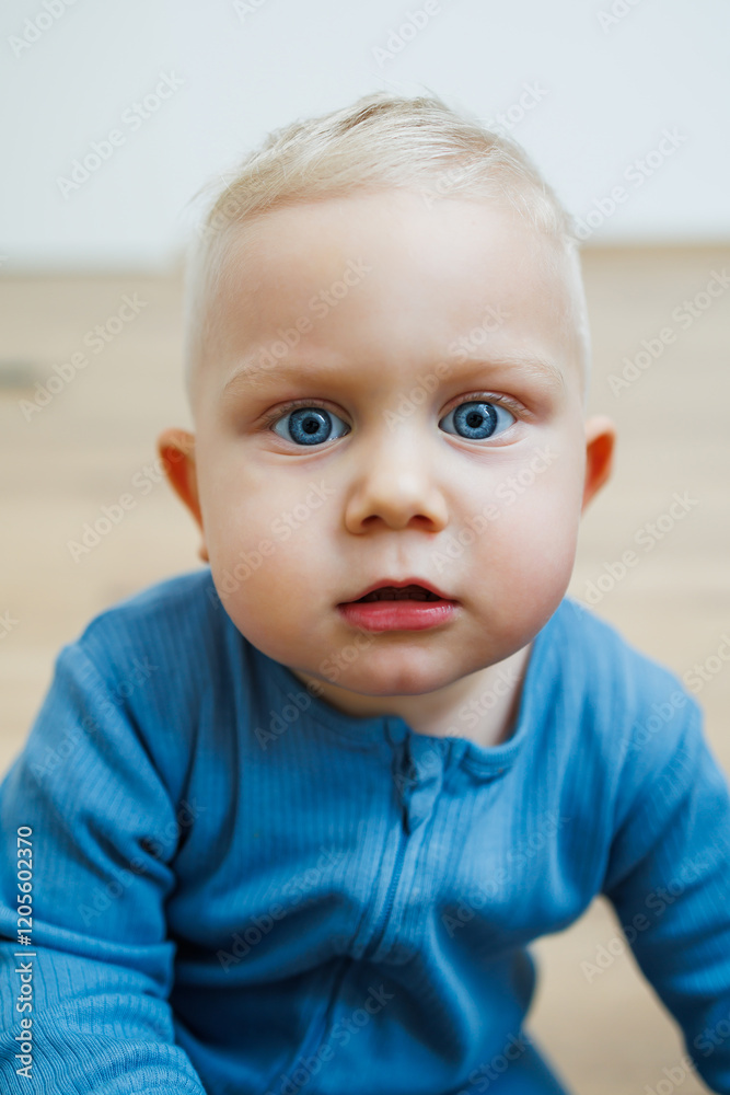 Little one-year-old boy with different emotions on his face close-up. Emotional baby. Cheerful boy. Blue-eyed toddler boy. Little one-year-old boy with different emotions on his face close-up. Emotional baby. Cheerful boy. Blue-eyed toddler boy.