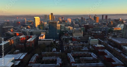 Aerial video of Manchester's frosty cityscape in the morning touched by the Sunrise  photo