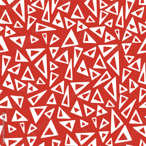 Bold and dynamic geometric pattern with white triangles of various sizes on a red background.