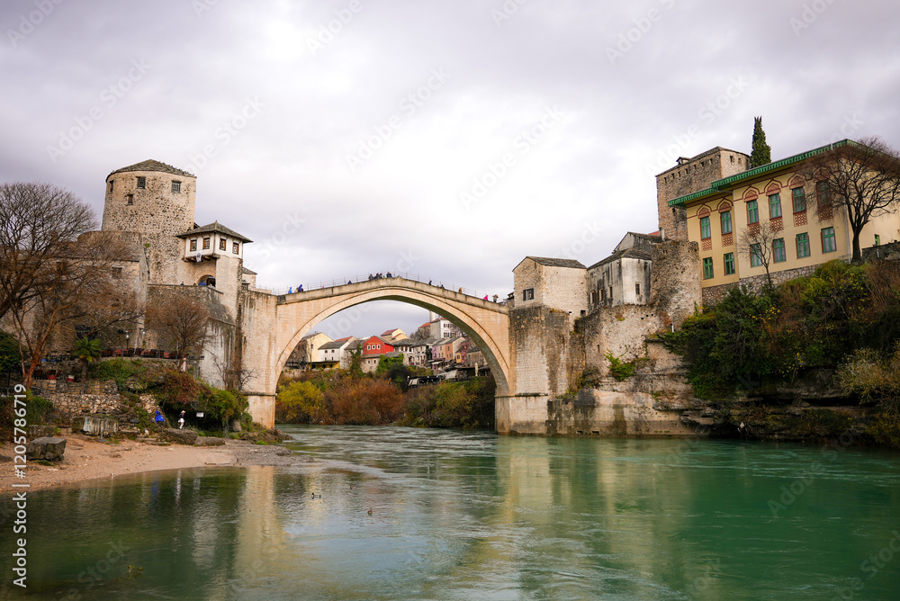 A beautiful view of the old bridge across the Neretva River in Mostar, Bosnia and Herzegovina A beautiful view of the old bridge across the Neretva River in Mostar, Bosnia and Herzegovina