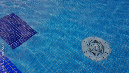 4k, video, Cleaning of the drain valve filter at the bottom of the swimming pool, movement of clear water, top view.