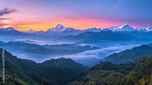 panoramic image of mist rising from mountain valley at dawn with layers of peaks fading into soft pastels photo