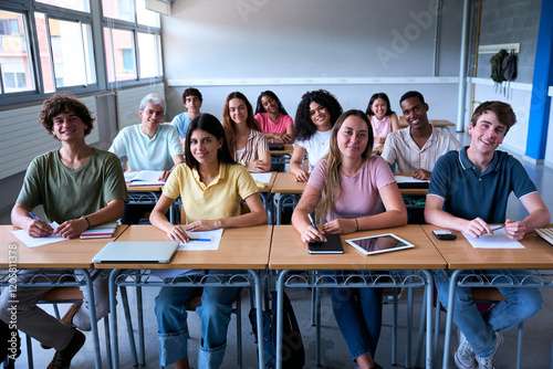 Smiling group of university college sitting at classroom looking at camera. Portrait of cheerful Students of high school. study together. People, education and community people. High quality photo