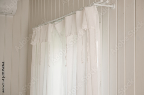 Obraz na płótnie White curtains with ties in a stylish interior of a cozy home w salonie