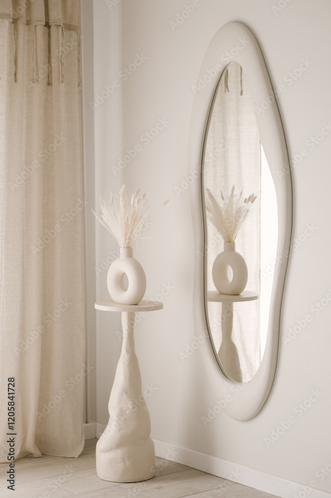 Beautiful light beige interior with curved mirror in wooden frame in japandi and wawabi sabi style, cozy home concept