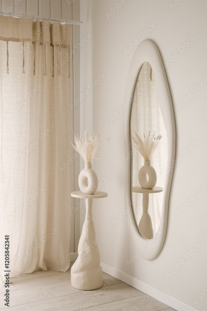 Beautiful light beige interior with curved mirror in wooden frame in japandi and wawabi sabi style, cozy home concept