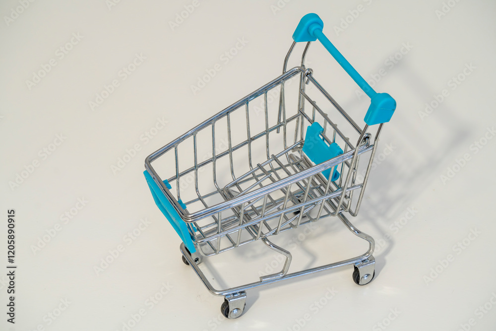 Miniature shopping cart for kids in bright blue and silver colors Miniature shopping cart for kids in bright blue and silver colors