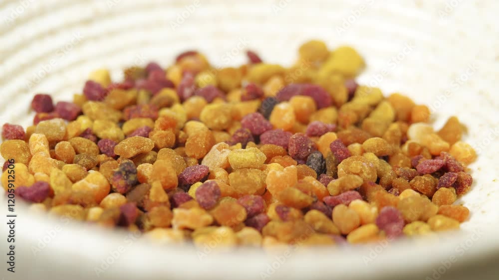 Dry Pollen Tea in a Ceramic Bowl. Rotating Flower Granules in Slow Motion. Alternative Medicine Concept. Natural Supplement Dry Pollen Tea in a Ceramic Bowl. Rotating Flower Granules in Slow Motion. Alternative Medicine Concept. Natural Supplement