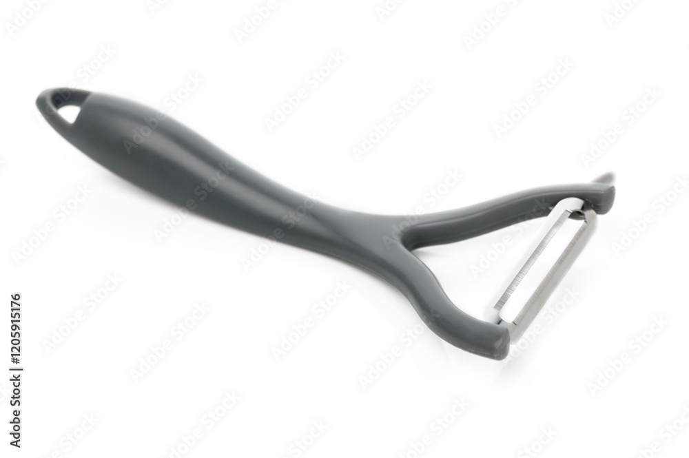 Discovering the art of peeling vegetables with a sleek kitchen tool in bright light Discovering the art of peeling vegetables with a sleek kitchen tool in bright light