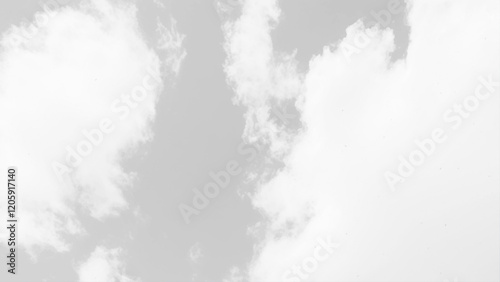 Fluffy white clouds stretch across a seamless sky background. Background texture of fluffy white clouds. 