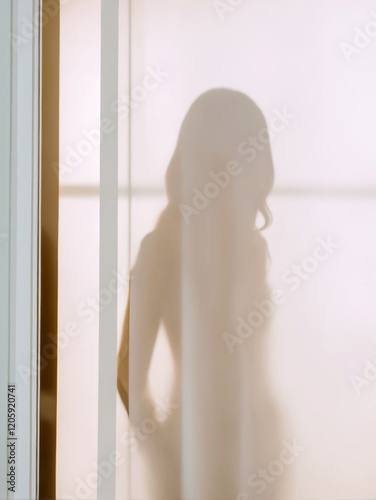 female silhouette in balcony door. woman body behind the curtain photo