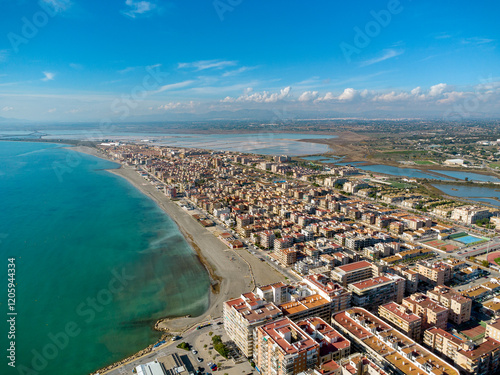 Aerial view of Santa Pola city. Panoramic aerial view of Gran Beach. Costal Mediterranean city and famous travel destination in South of Spain. Panoramic view of all region. Alicante Province