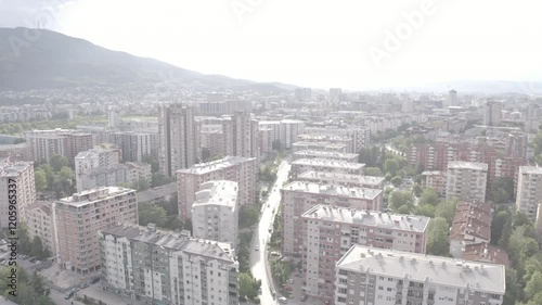 Aerial view of a densely packed city with numerous buildings and a bustling urban environment