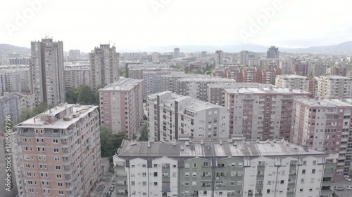 Aerial view of a densely packed city with numerous buildings and a bustling urban environment