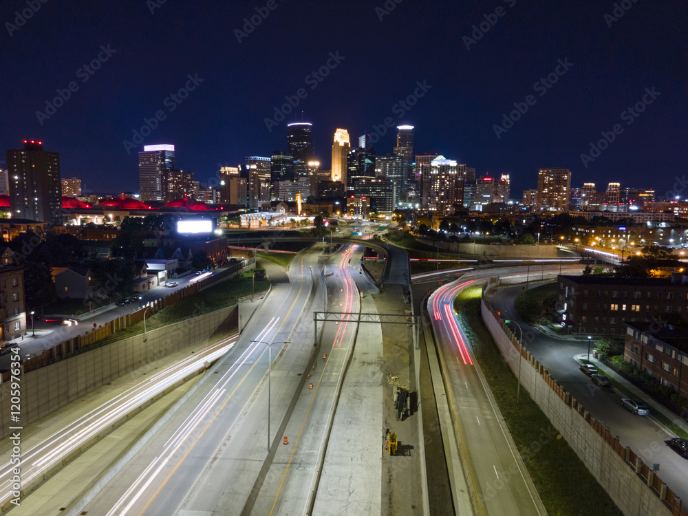 Minneapolis night skyline with highway lights Minneapolis night skyline with highway lights