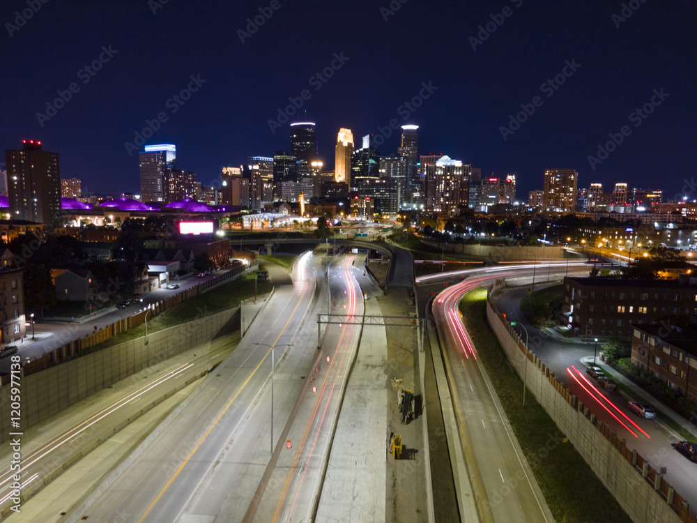 Minneapolis night skyline with highway lights Minneapolis night skyline with highway lights